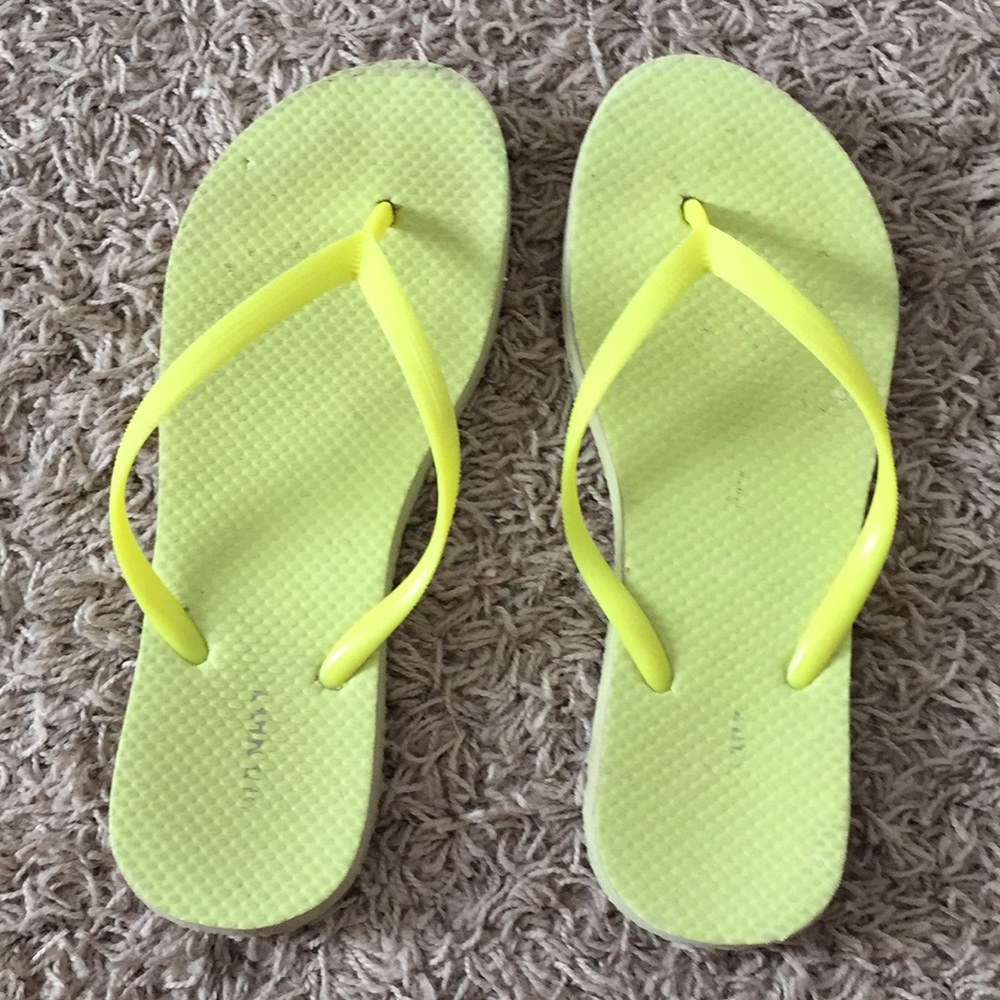 Bright yellow flip flops
